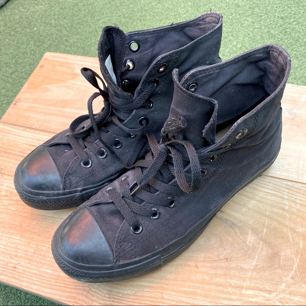 Black high top Converse shoes